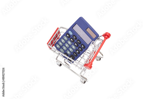 Calculator in shopping trolley cart isolated on white.Financial