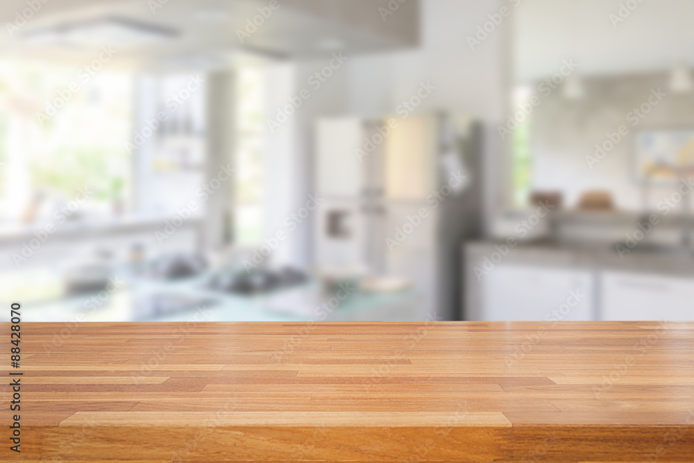 Empty wooden table and blurred kitchen background Empty wooden table and blurred kitchen background