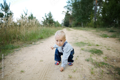 little boy plays on the road © Aliaksei Lasevich
