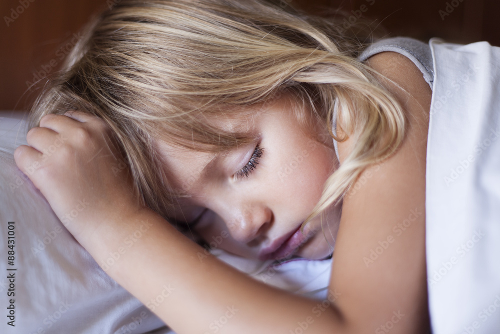 Adorable little girl sleeping in a bed
Adorable little girl sleeping in a bed