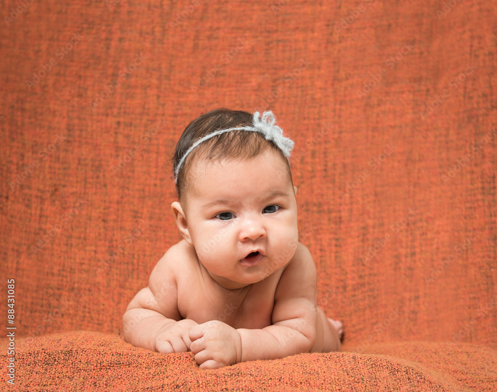two-month-old girl with decoration on a head two-month-old girl with decoration on a head