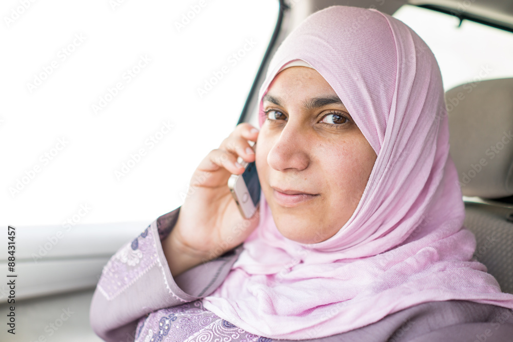 Happy Muslim woman driving on summer vacation Happy Muslim woman driving on summer vacation