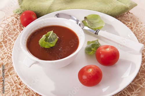 tomato soup in a white bowl 
