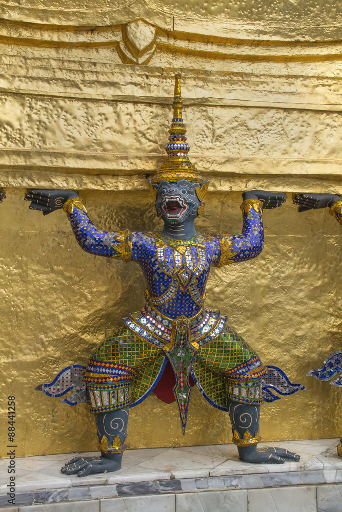 Statue of mythical demon at the chedi or tower in the Wat Phra Kaeo.Bangkok,Thailand