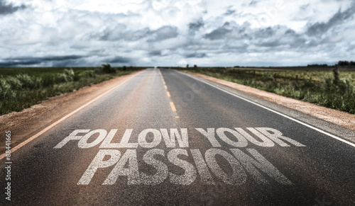 Follow Your Passion written on rural road photo