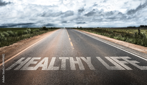 Healthy Life written on rural road