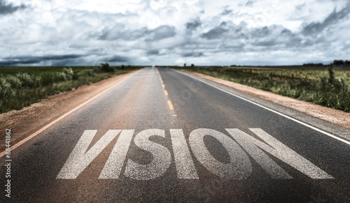 Vision written on rural road photo