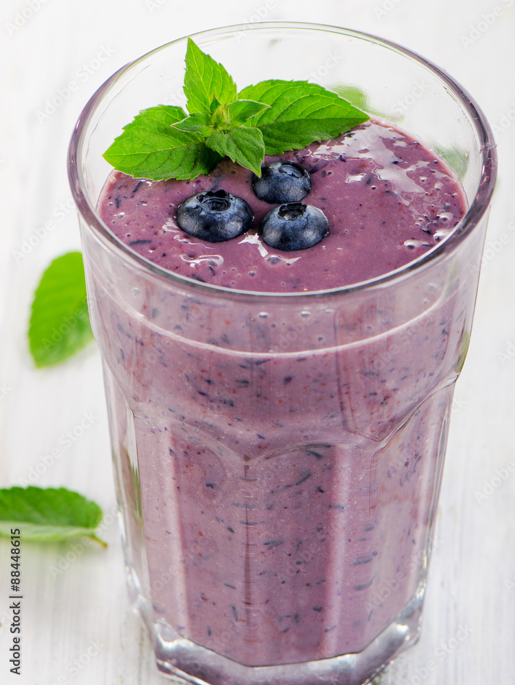 Glass of fresh blueberry smoothie. Glass of fresh blueberry smoothie.
