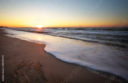 Fototapeta Naklejka Na Ścianę i Meble -  Sunset and sea. Beach and sea sunset.