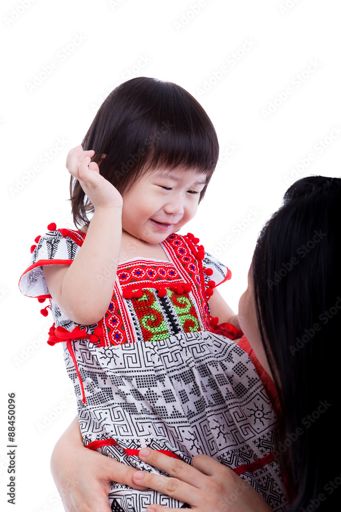 Asian mother playing her adorable little daughter, on white background. Asian mother playing her adorable little daughter, on white background.