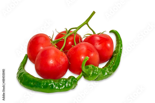 Branch of tomatoes and two green peppers chili