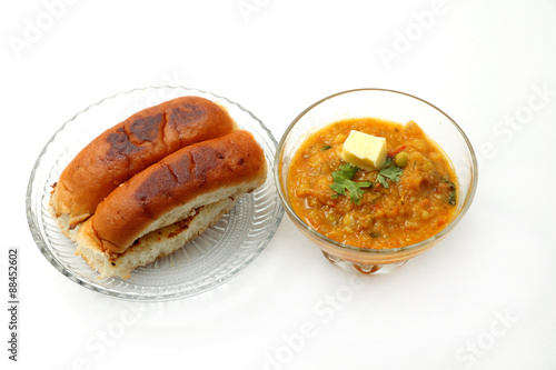 pav bhaji an indian cuisine or dish prepared with crushing mixed vegetables mainly potatoes,tomato,peas and some other green vegetables made spicy and served with butter