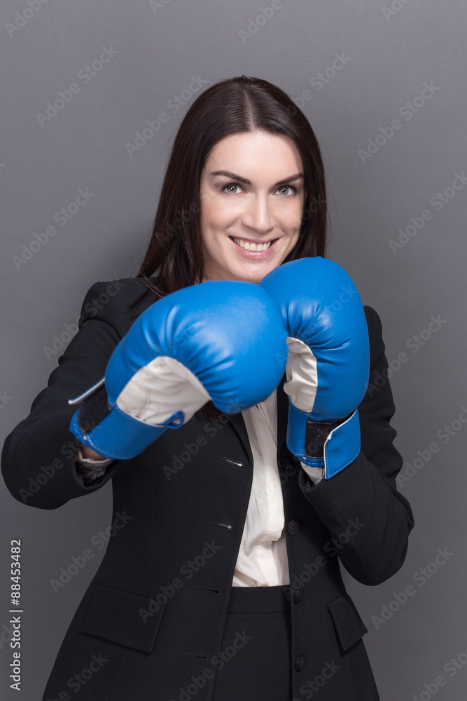 Business lady in boxing gloves Business lady in boxing gloves