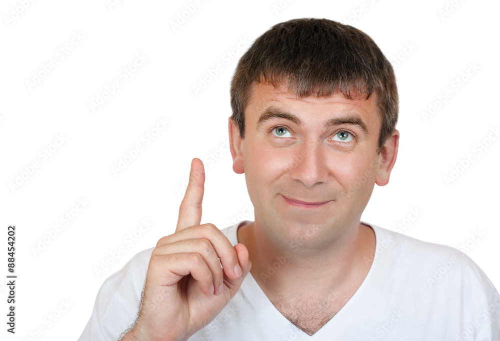 Man pointing his index finger and looking upward isolated on white background Man pointing his index finger and looking upward isolated on white background