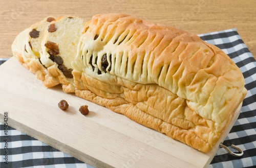 Sliced Raisin Bread on A Wooden Cutting Board