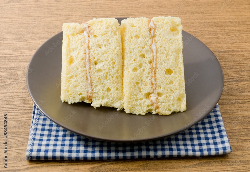 Triangle Vanilla Chiffon Cake on A White Dish