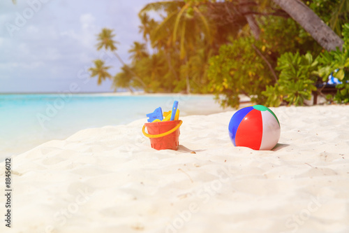 Fototapeta Naklejka Na Ścianę i Meble -  kids toys on tropical sand beach