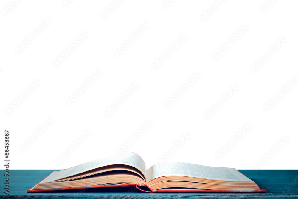 Open book on a table Open book on a table
