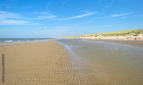 Blue cloudy sky over a beach in summer