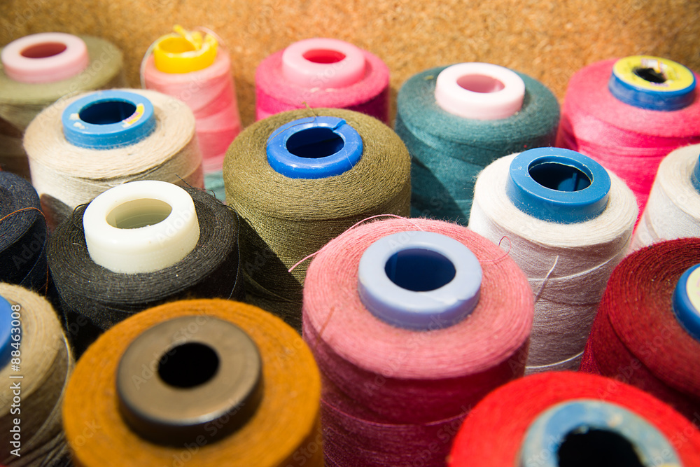 Many reels of threads standing on the table Many reels of threads standing on the table