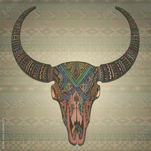 Decorative indian bull scull in tribal style on ornamental backg