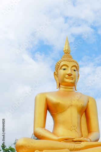 This is Gold Buddha statue in the asian temple, With sky background.