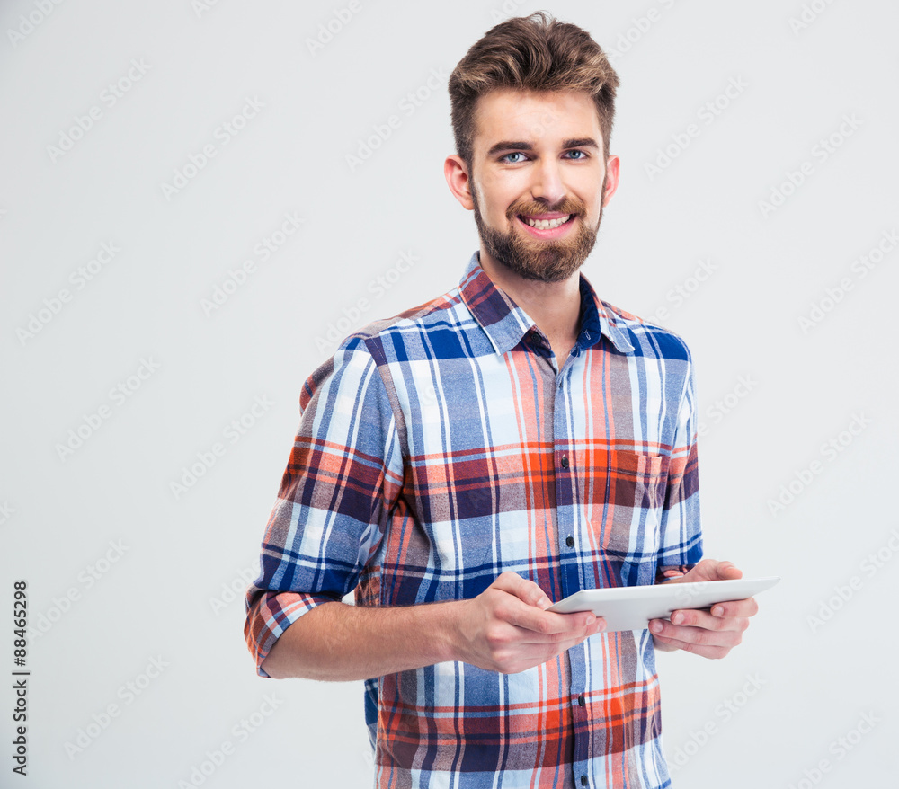 Smiling man using tablet computer Smiling man using tablet computer