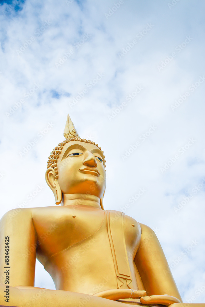 This is Gold Buddha statue in the asian temple, With sky background.