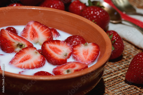 Strawberry close-up bowl with milk