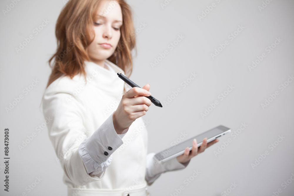 young woman with pen on grey background young woman with pen on grey background