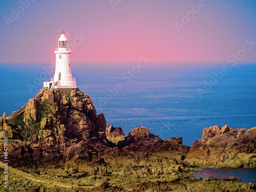 White lighthouse on Jersey Island. Image is toned