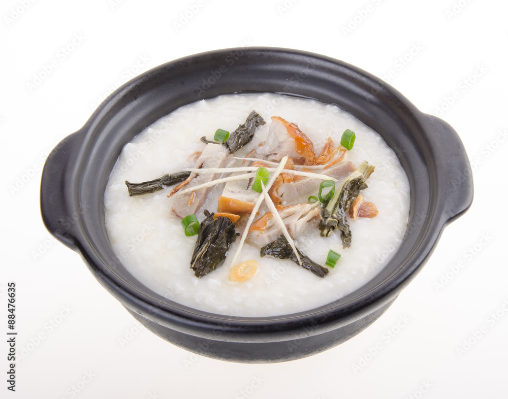 Traditional chinese pork porridge rice gruel served in claypot