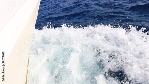 Sailing boat with water splash at Adritic sea photo