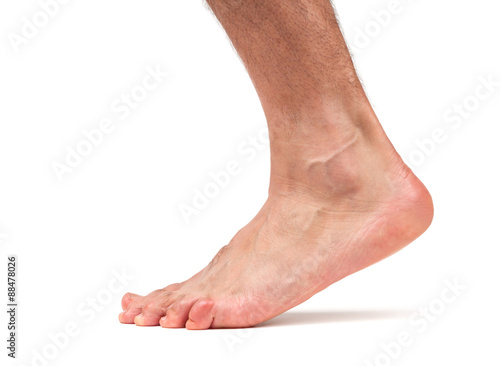 Bare male foot walking photo