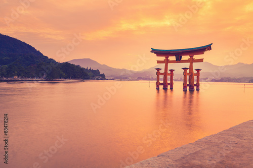 The famous orange shinto gate (Torii) of Miyajima island, Hiroshima prefecture, Japan. photo