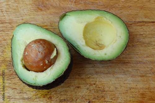 Fresh avocado stored on wooden background
