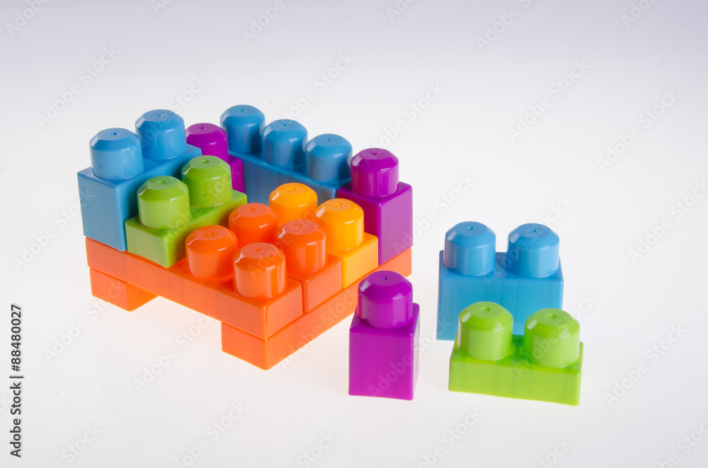 Plastic building blocks on background Plastic building blocks on background
