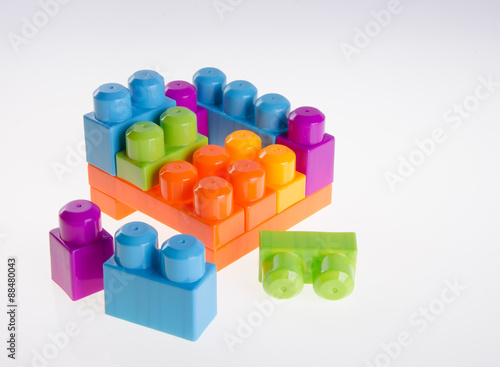 Plastic building blocks on background