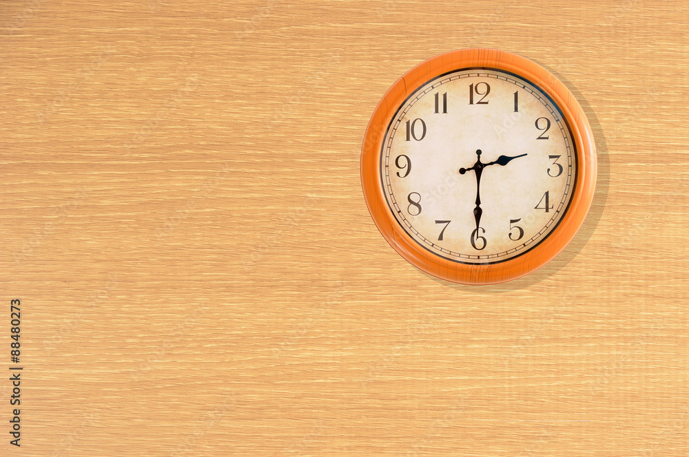 Clock showing 2:30 o'clock on a wooden wall Clock showing 2:30 o'clock on a wooden wall