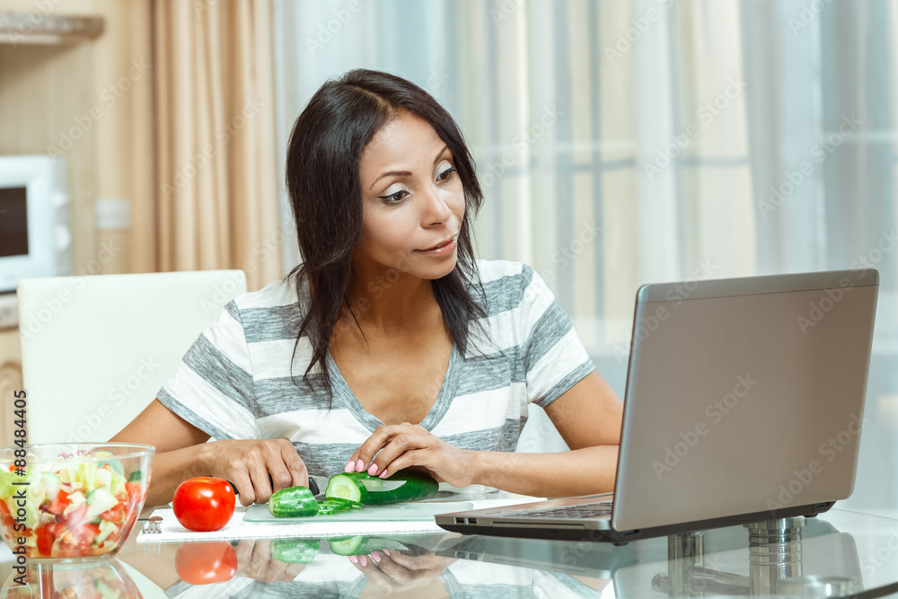 Beautiful woman checks the recipe Beautiful woman checks the recipe