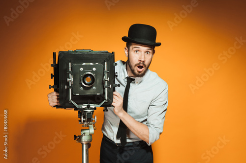 young man with retro camera 