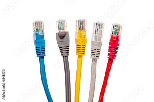 Multicolored network cables with connectors RJ45 on a white background