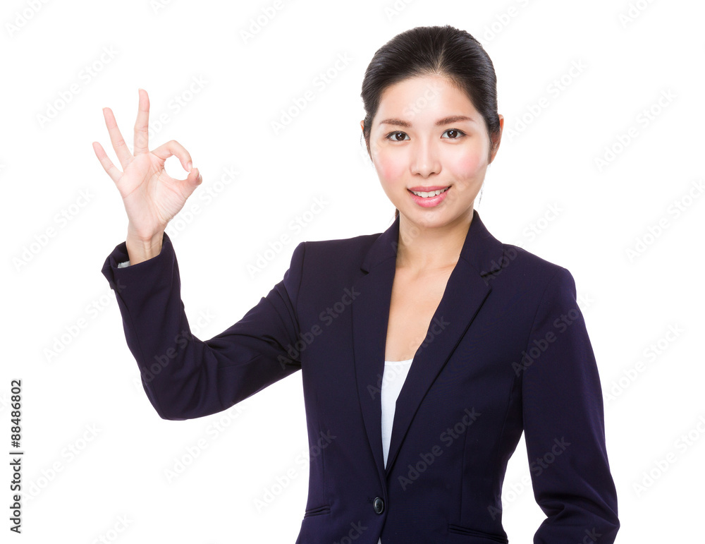 Businesswoman with ok sign gesture Businesswoman with ok sign gesture