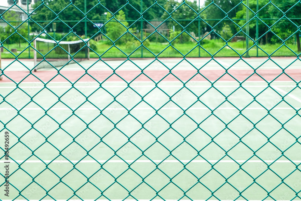 Fototapeta premium Green fence mesh for partition tennis court