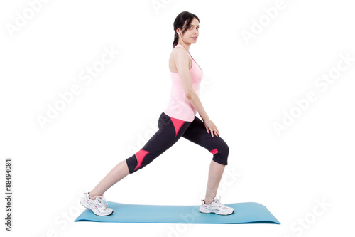girl on mat doing leg exercises