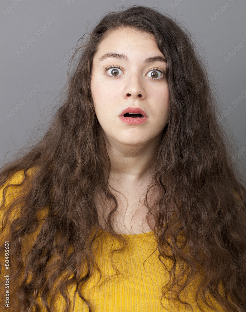 fear concept - young overweight woman with long brown hair looking ...