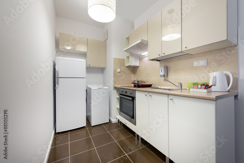 White, small and compact kitchen interior design © Cinematographer