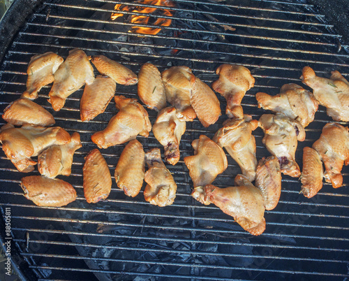 Chicken wings and drumsticks on a grill