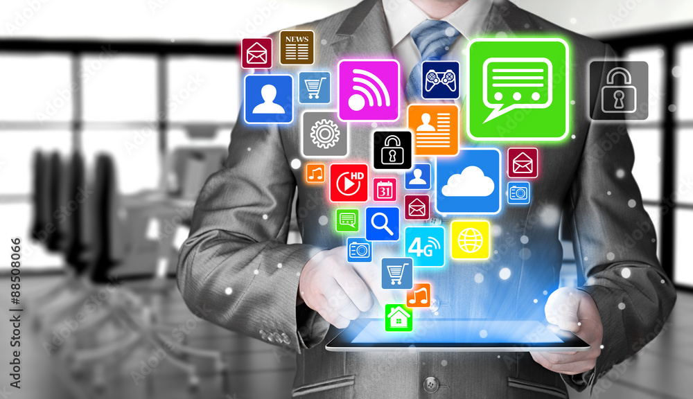 Business man using tablet PC with social media icon set Business man using tablet PC with social media icon set