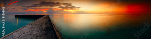 Panorama of tropical sunset on Maldives over sea ocean, travel and vacation c...